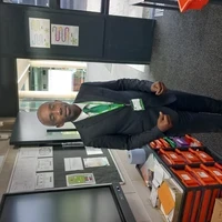 Image of Junior Watson, a SCITT trainee, stood in his classroom