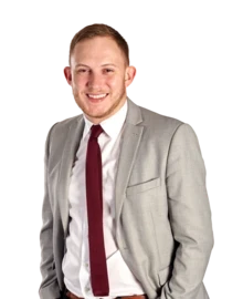 School leader smiles at camera