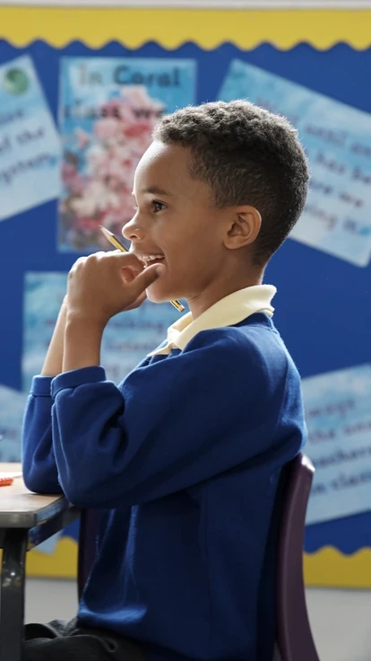 male student listening in class