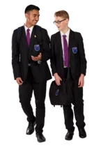 Two pupils walking alongside one another and talking.